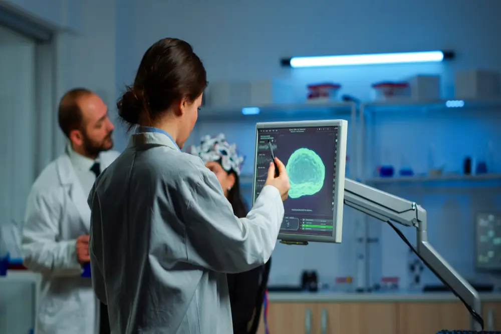 researcher looking monitor analysing brain scan while coworker discussing with patient background about side effects mind functions nervous system tomography scan working laboratory (1)